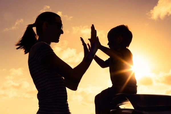 Image of happy mother and child after resolving child arrangements Redhill